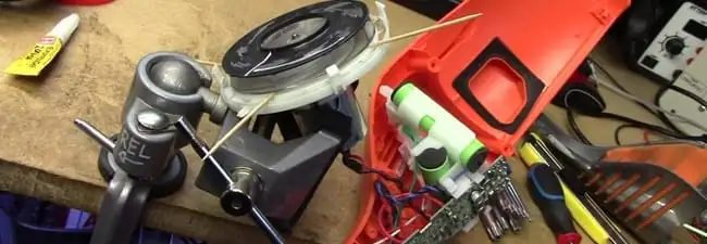 Vacuum cleaner repair parts and tools on a workbench in Fort Wayne, IN